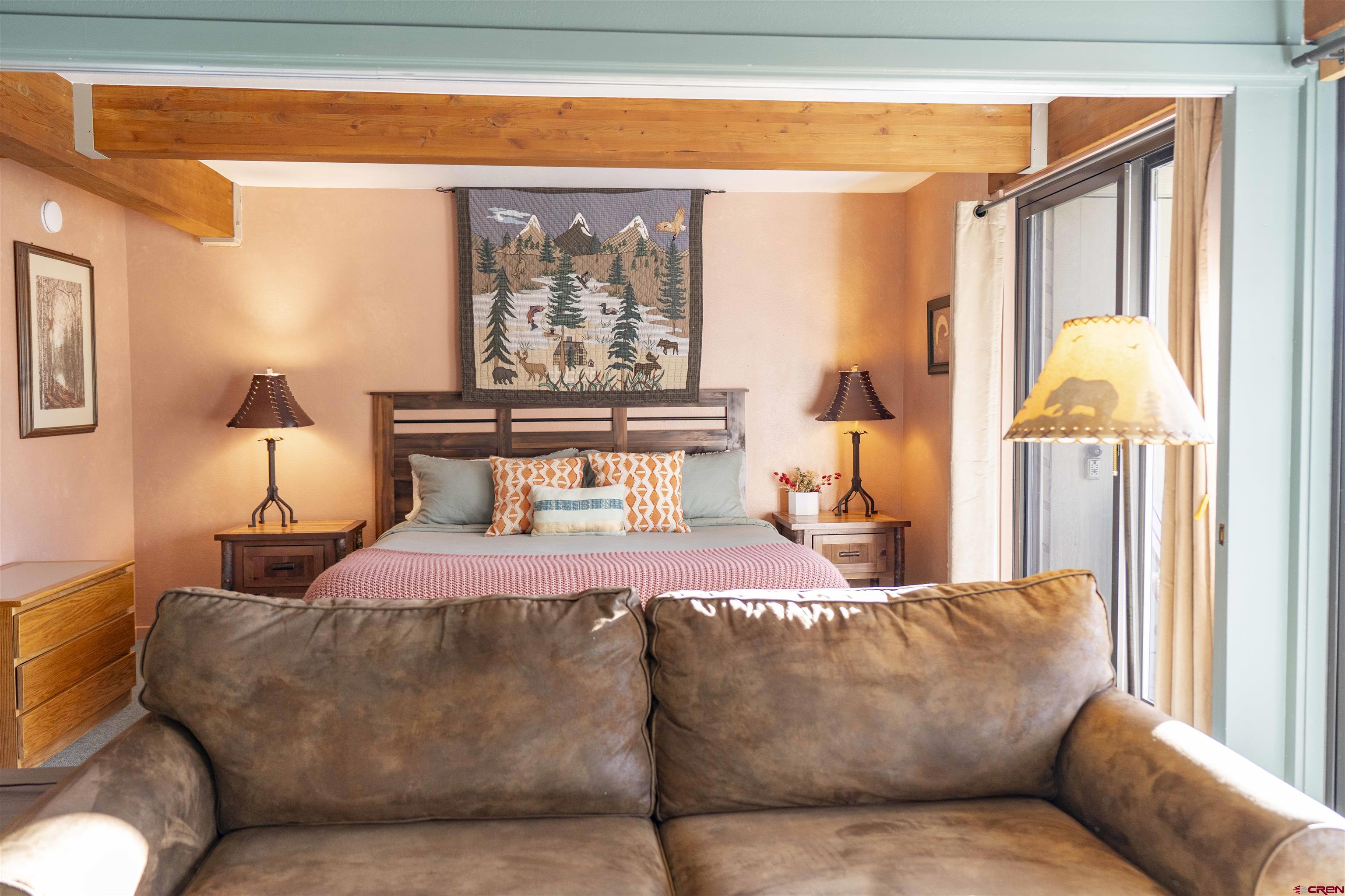 11 Hunter Hill Road, Unit 406 Crested Butte, CO 81225 - Photo 19 of 45 a living room with furniture and a window