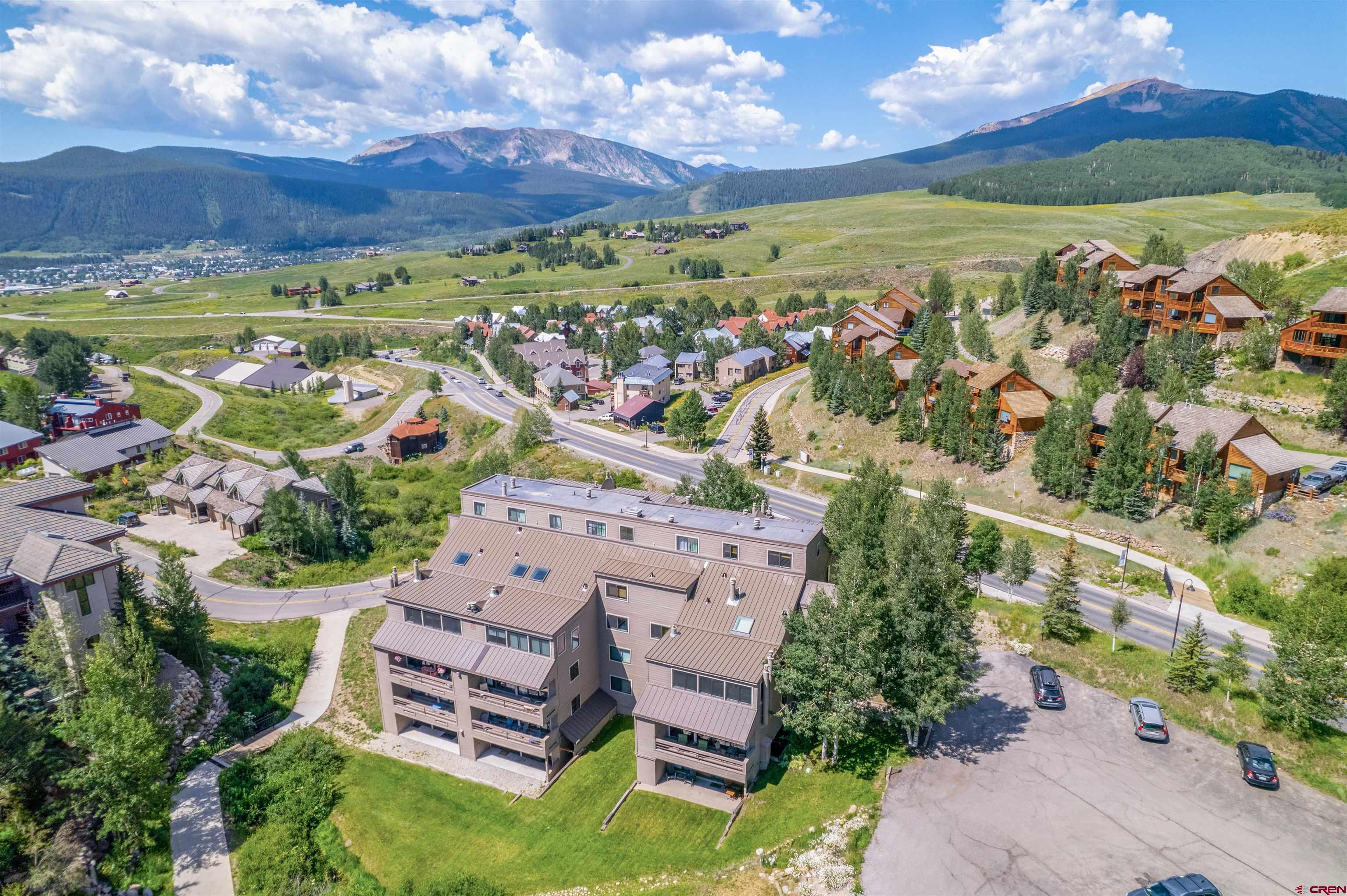 11 Hunter Hill Road, Unit 406 Crested Butte, CO 81225 - Photo 2 of 45 a view of a city with an ocean