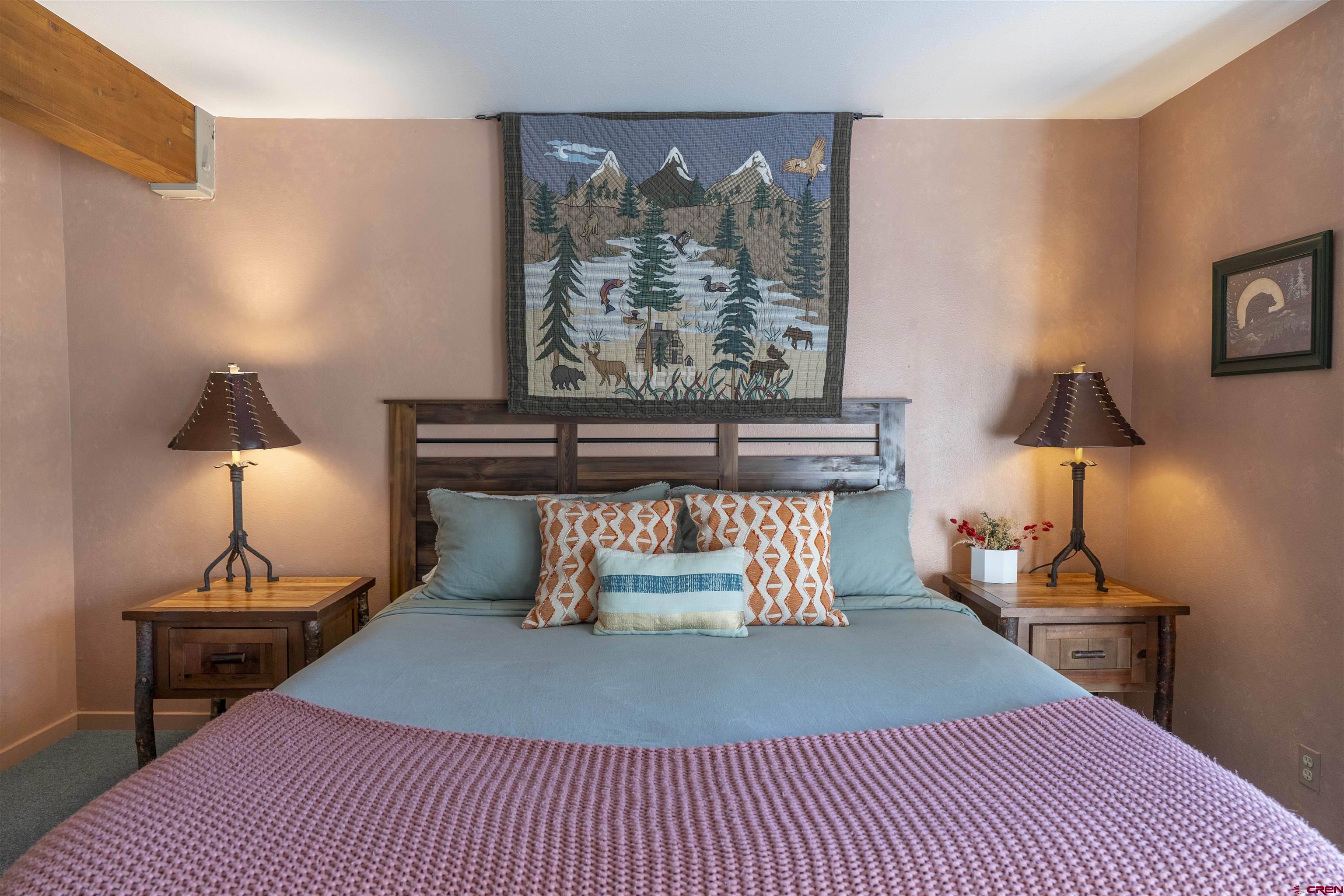 11 Hunter Hill Road, Unit 406 Crested Butte, CO 81225 - Photo 26 of 45 a room with furniture and a lamp