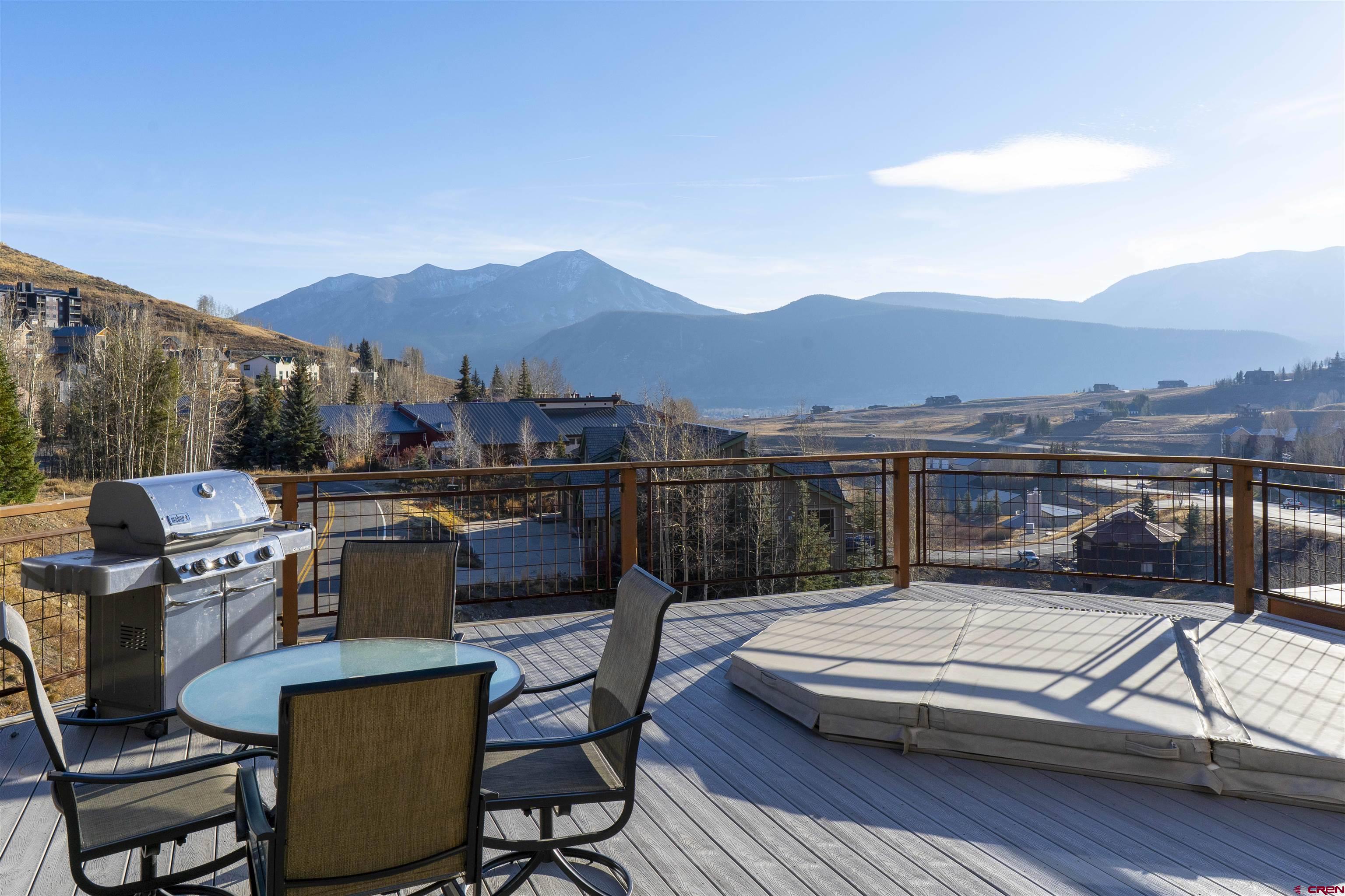 11 Hunter Hill Road, Unit 406 Crested Butte, CO 81225 - Photo 3 of 45 a view of a chairs and table in patio