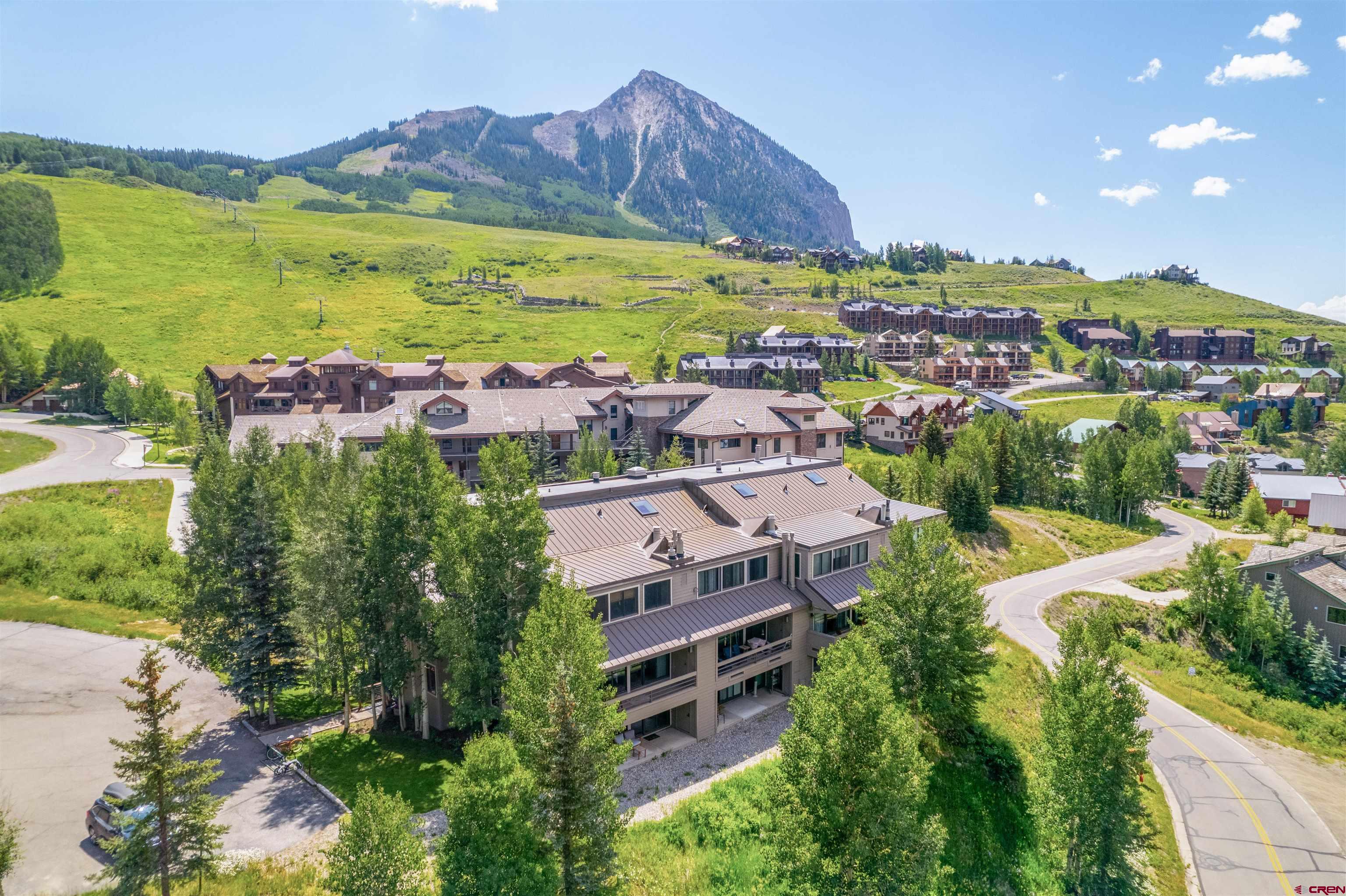 11 Hunter Hill Road, Unit 406 Crested Butte, CO 81225 - Photo 34 of 45 an aerial view of residential building and lake