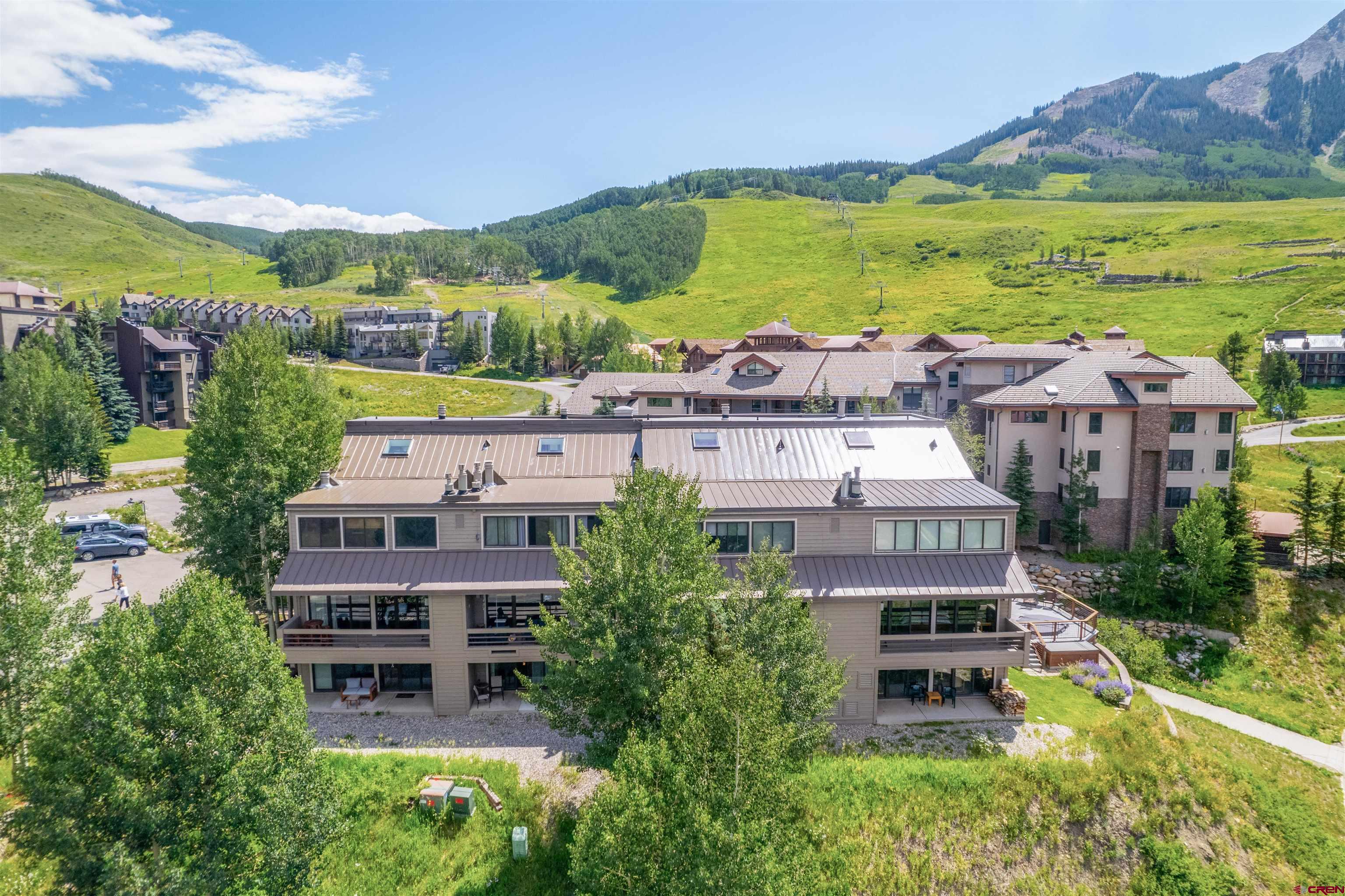 11 Hunter Hill Road, Unit 406 Crested Butte, CO 81225 - Photo 35 of 45 a aerial view of a house with a garden