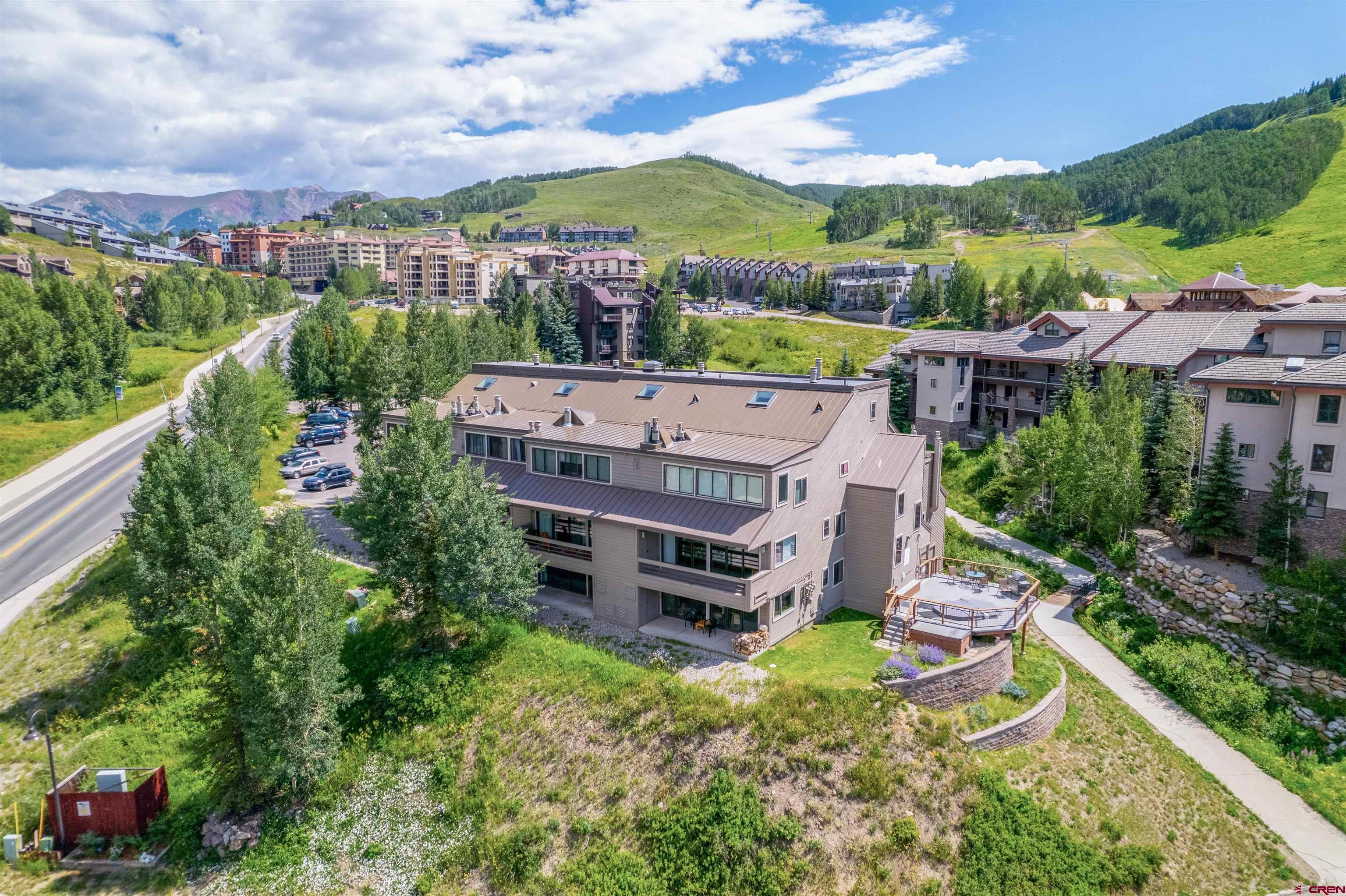 11 Hunter Hill Road, Unit 406 Crested Butte, CO 81225 - Photo 36 of 45 an aerial view of a house with a garden