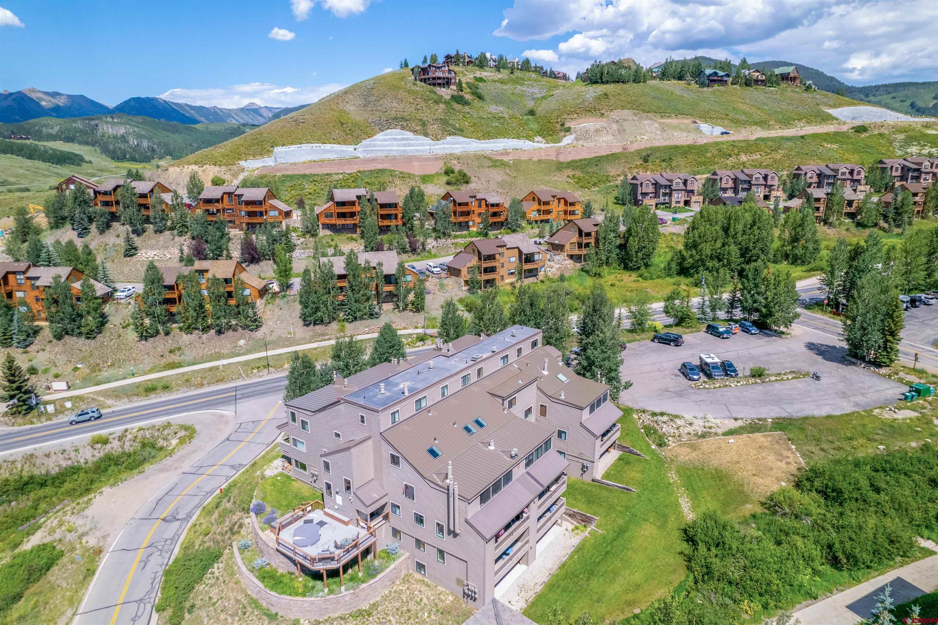 11 Hunter Hill Road, Unit 406 Crested Butte, CO 81225 - Photo 37 of 45 an aerial view of a house with a garden