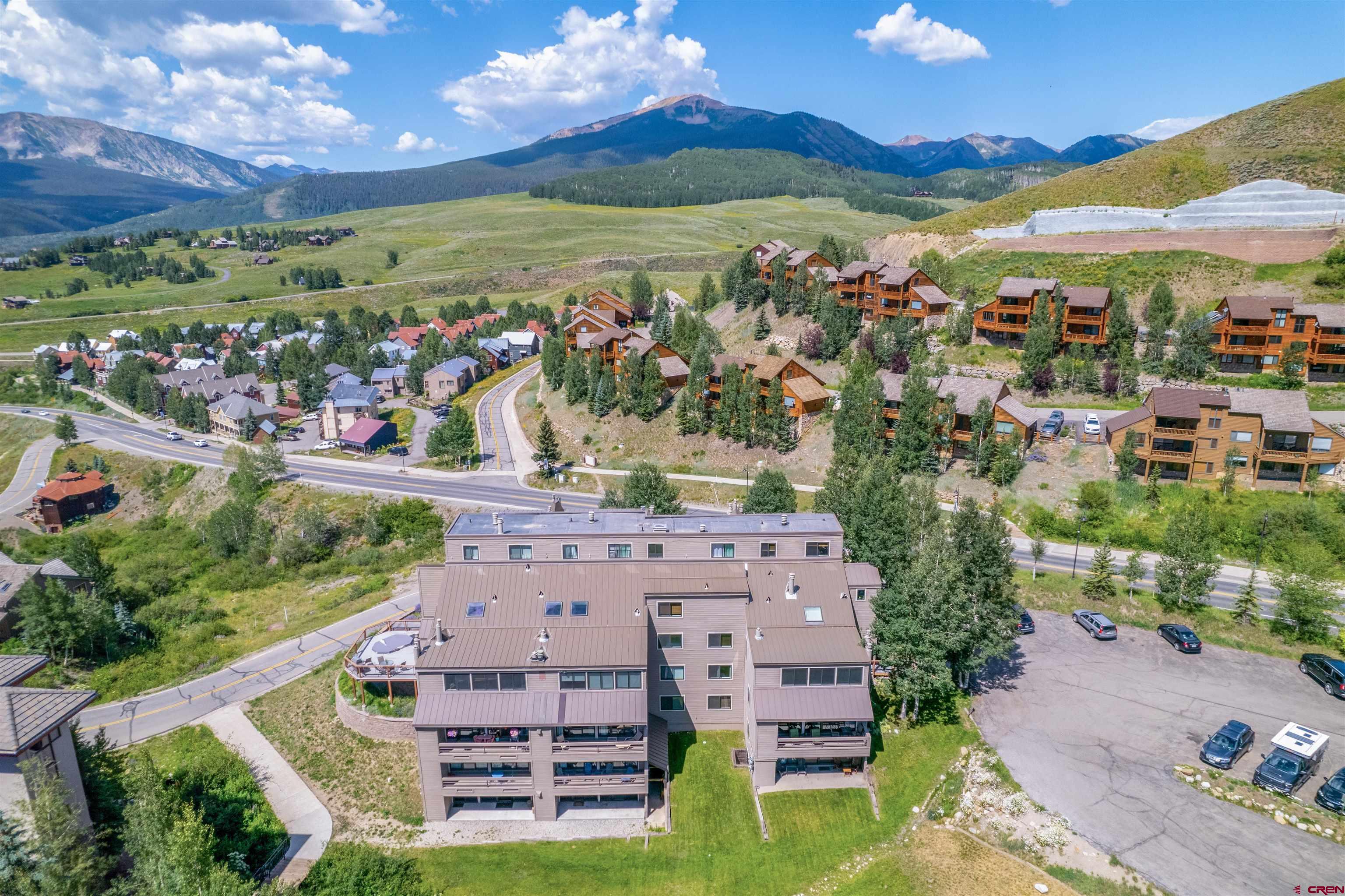 11 Hunter Hill Road, Unit 406 Crested Butte, CO 81225 - Photo 39 of 45 an aerial view of residential houses with outdoor space and ocean view