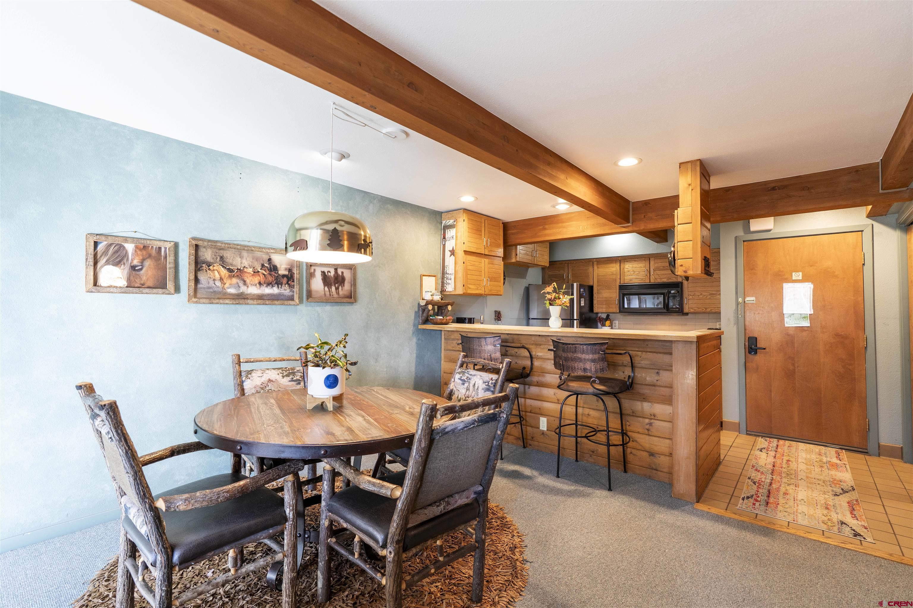 11 Hunter Hill Road, Unit 406 Crested Butte, CO 81225 - Photo 4 of 45 a outdoor dining space with furniture and window