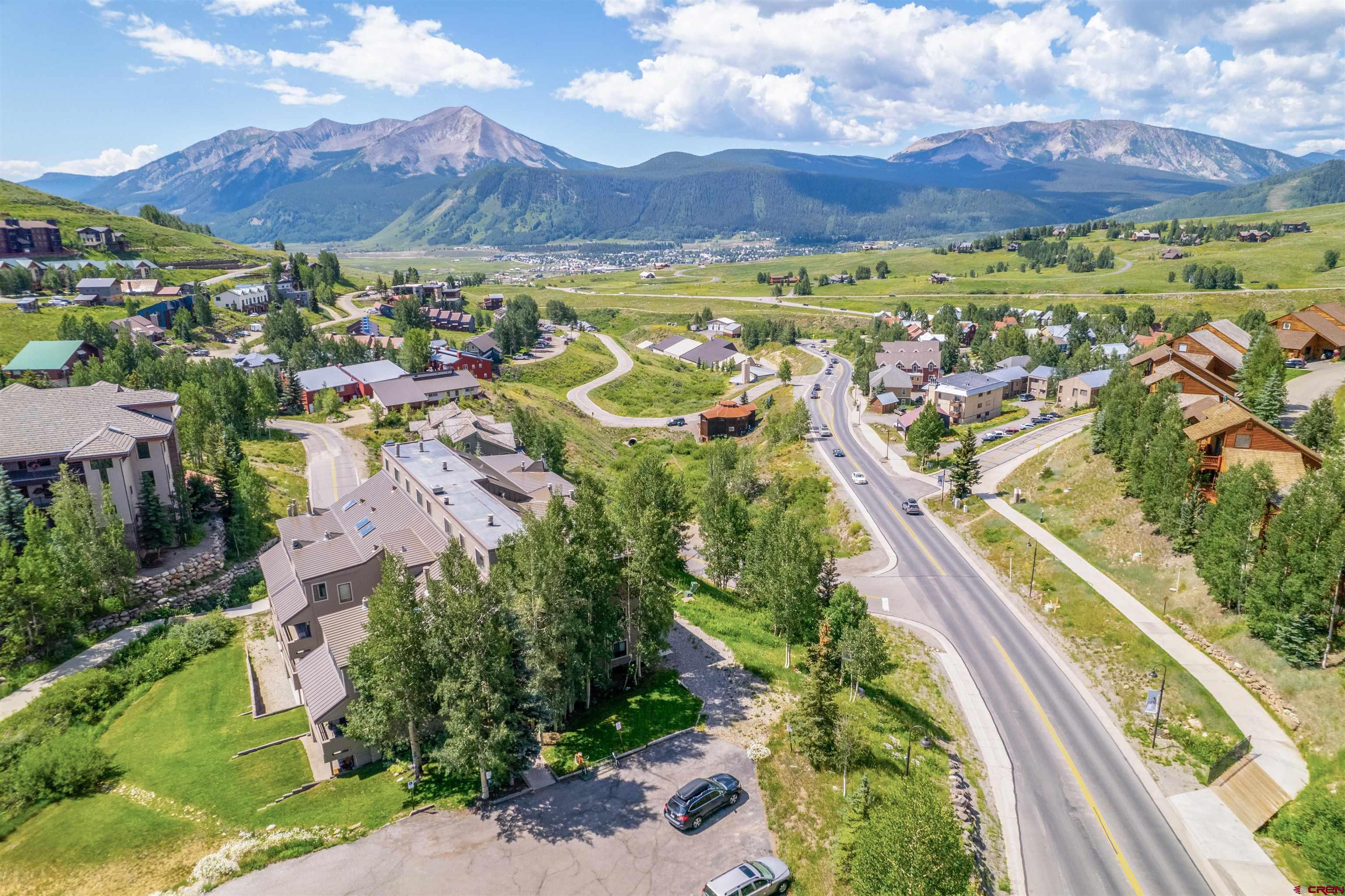 11 Hunter Hill Road, Unit 406 Crested Butte, CO 81225 - Photo 43 of 45 an aerial view of residential houses with outdoor space and river