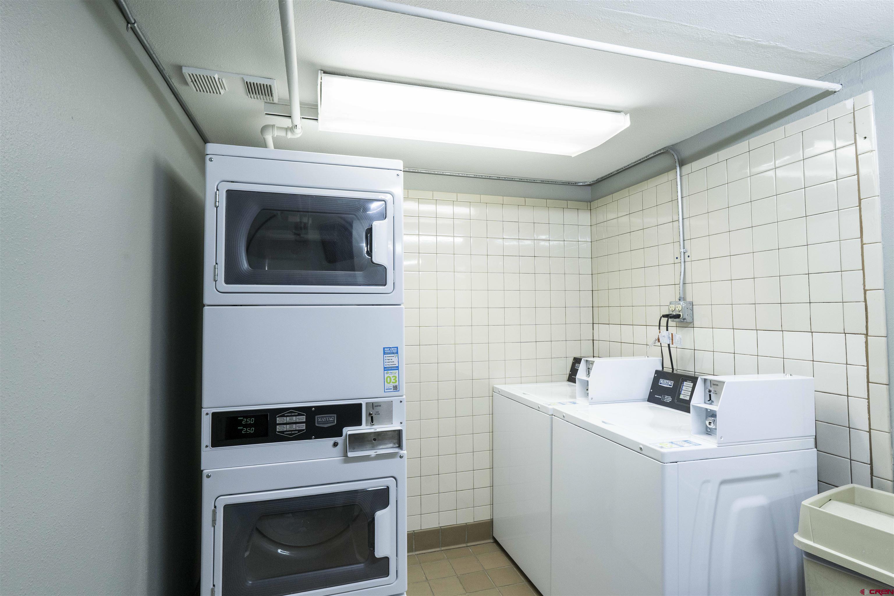 11 Hunter Hill Road, Unit 406 Crested Butte, CO 81225 - Photo 45 of 45 a bathroom with a sink a washer and dryer
