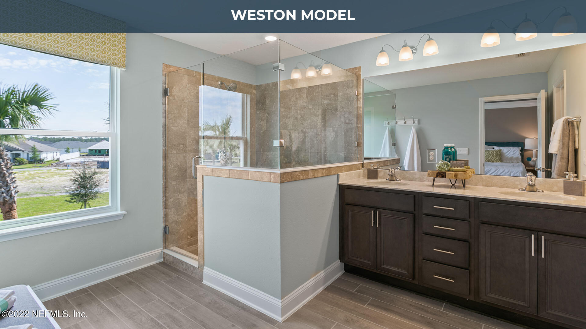 191 Millerstone Drive St. Augustine, FL 32092 - Photo 17 of 44 a bathroom with a double vanity sink and a mirror