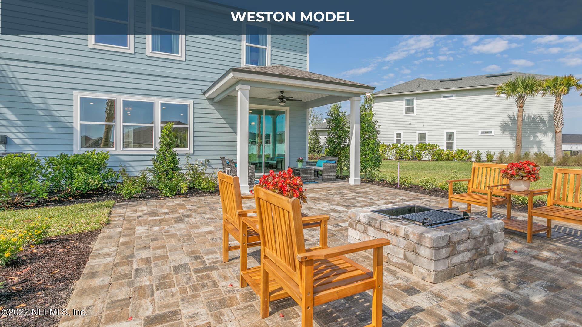 191 Millerstone Drive St. Augustine, FL 32092 - Photo 19 of 44 a view of a patio with table and chairs potted plants and floor to ceiling window