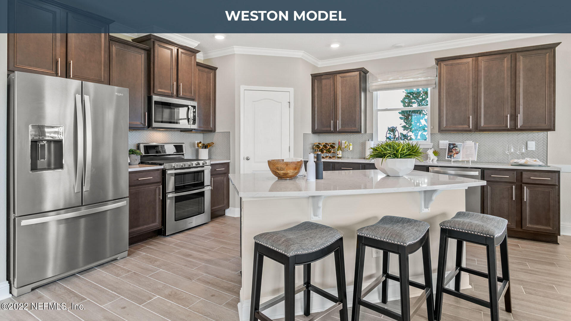 191 Millerstone Drive St. Augustine, FL 32092 - Photo 7 of 44 a kitchen with stainless steel appliances a sink and a refrigerator