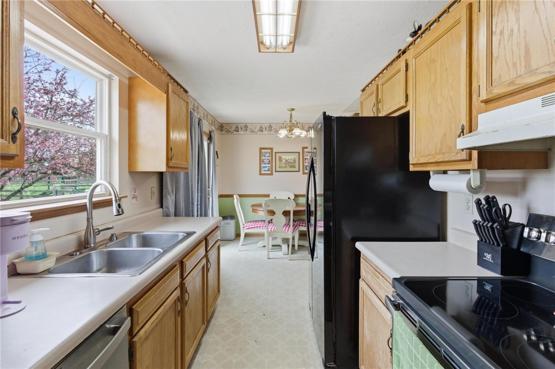 8747 Waynes Way Blanchester, OH 45107 - Photo 9 of 40 This cozy kitchen with abundant natural light offers comfortable meal preparation and casual dining.
