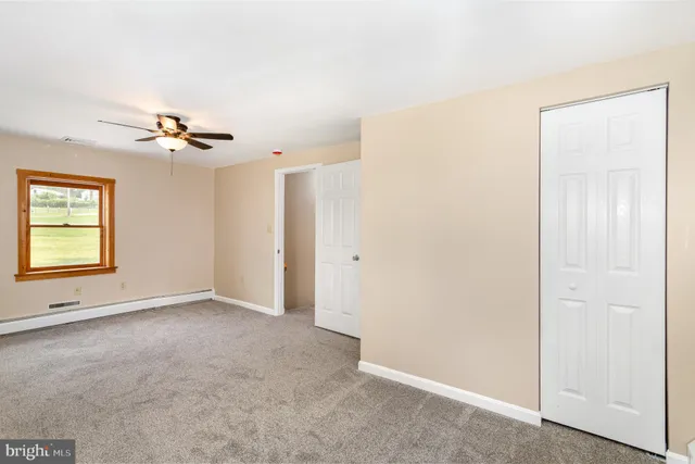 a view of a room with wooden shelves