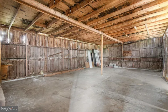 a view of a house with swimming pool and sitting area