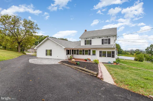 a view of a street with a yard