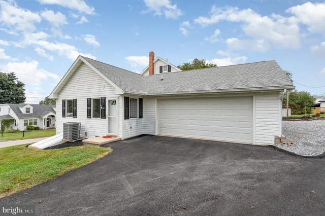 a view of outdoor space with garden and trees