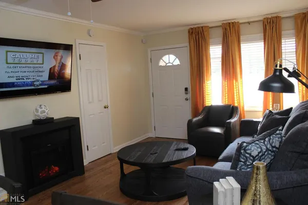 a living room with furniture and a window