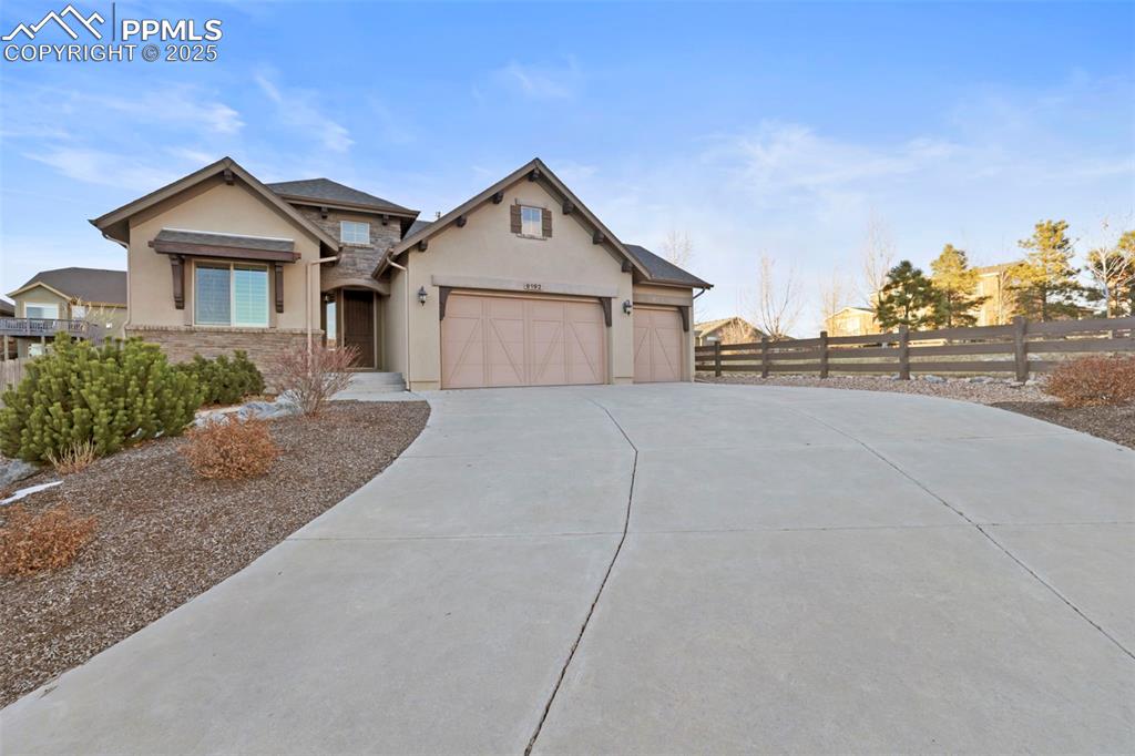 9192 Argentine Pass Trail Colorado Springs, CO 80924 - Photo 1 of 50 a view of a house with a yard and garage