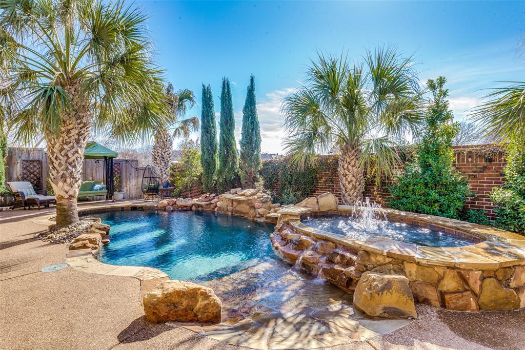 6801 Beckworth Lane Plano, TX 75024 - Photo 1 of 1 a view of swimming pool with a table and chairs