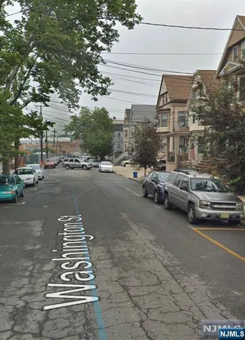 a view of a street with cars