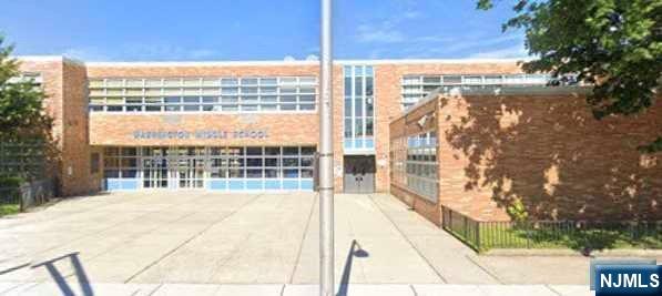 44 Washington Street, Unit 2F Harrison, NJ 07029 - Photo 8 of 9 a view of balcony with a floor to ceiling window