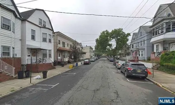 a view of a street with cars