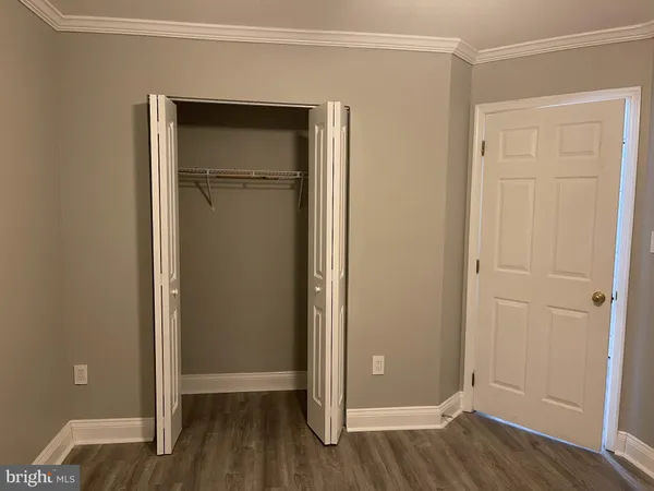 an empty room and wooden door