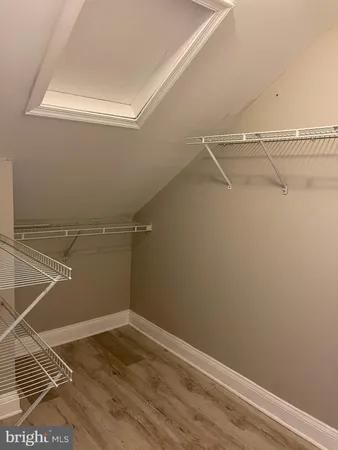 a bathroom with a shower sink and mirror