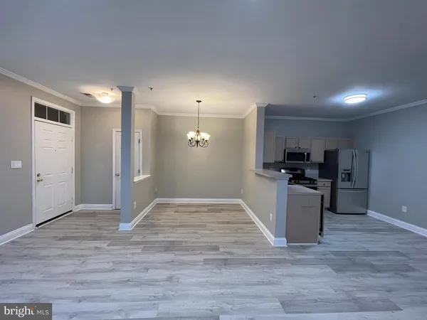 a view of kitchen with wooden floor