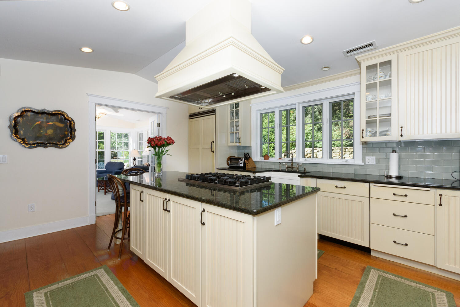 327 Hollow Tree Ridge Road Darien, CT 06820 - Photo 14 of 37 a kitchen with granite countertop a stove a sink and a refrigerator