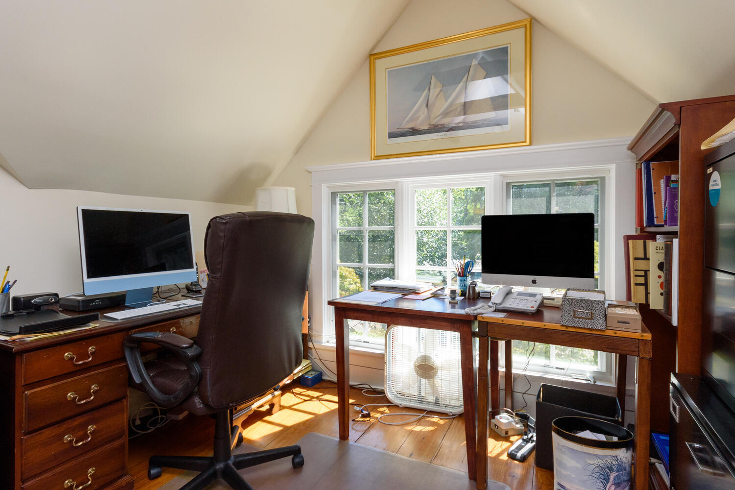 327 Hollow Tree Ridge Road Darien, CT 06820 - Photo 26 of 37 a view of a workspace with furniture and a flat screen tv