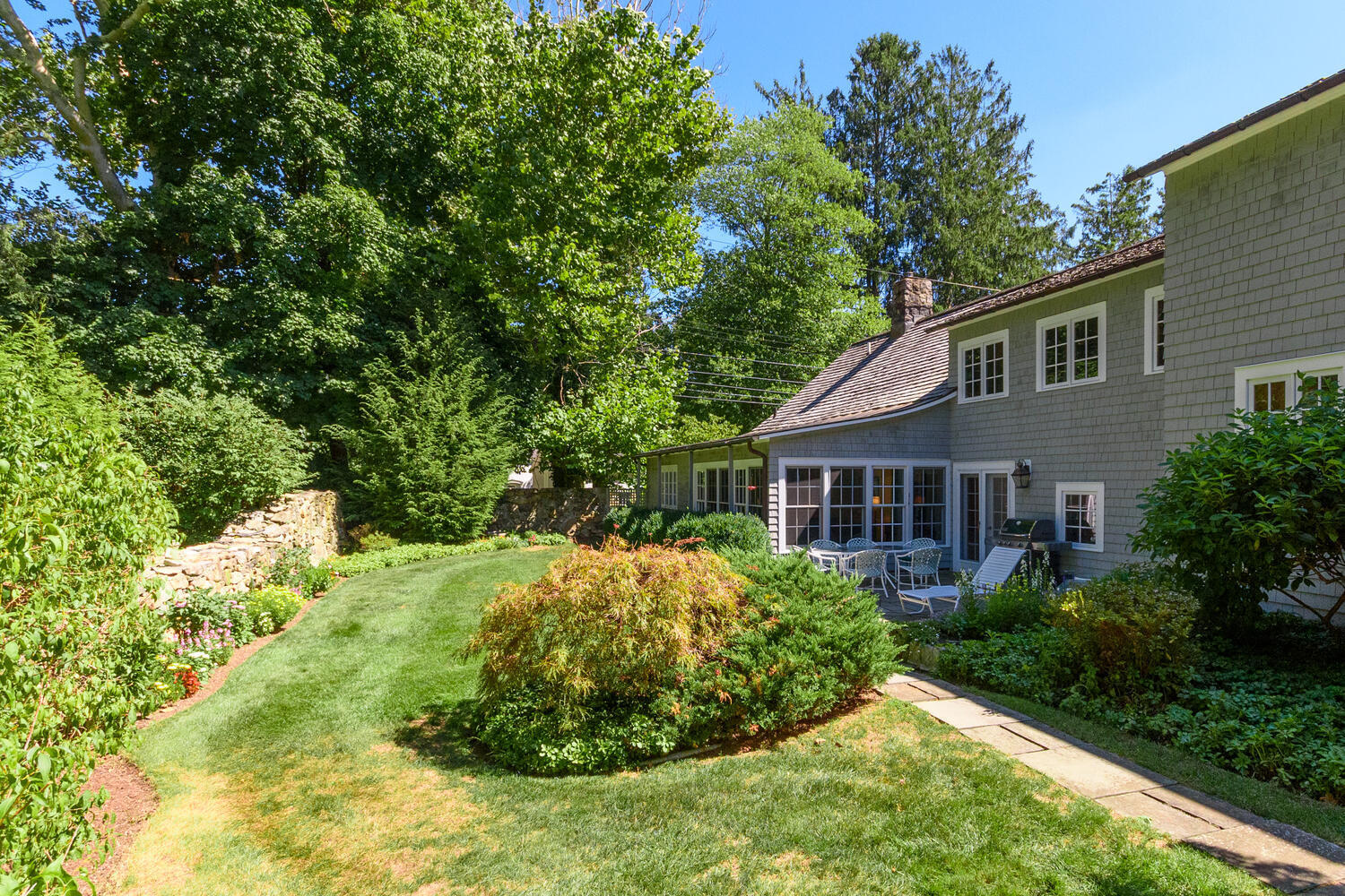 327 Hollow Tree Ridge Road Darien, CT 06820 - Photo 31 of 37 a view of a house with a yard
