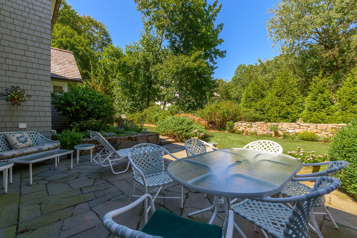 327 Hollow Tree Ridge Road Darien, CT 06820 - Photo 32 of 37 a balcony with table and chairs