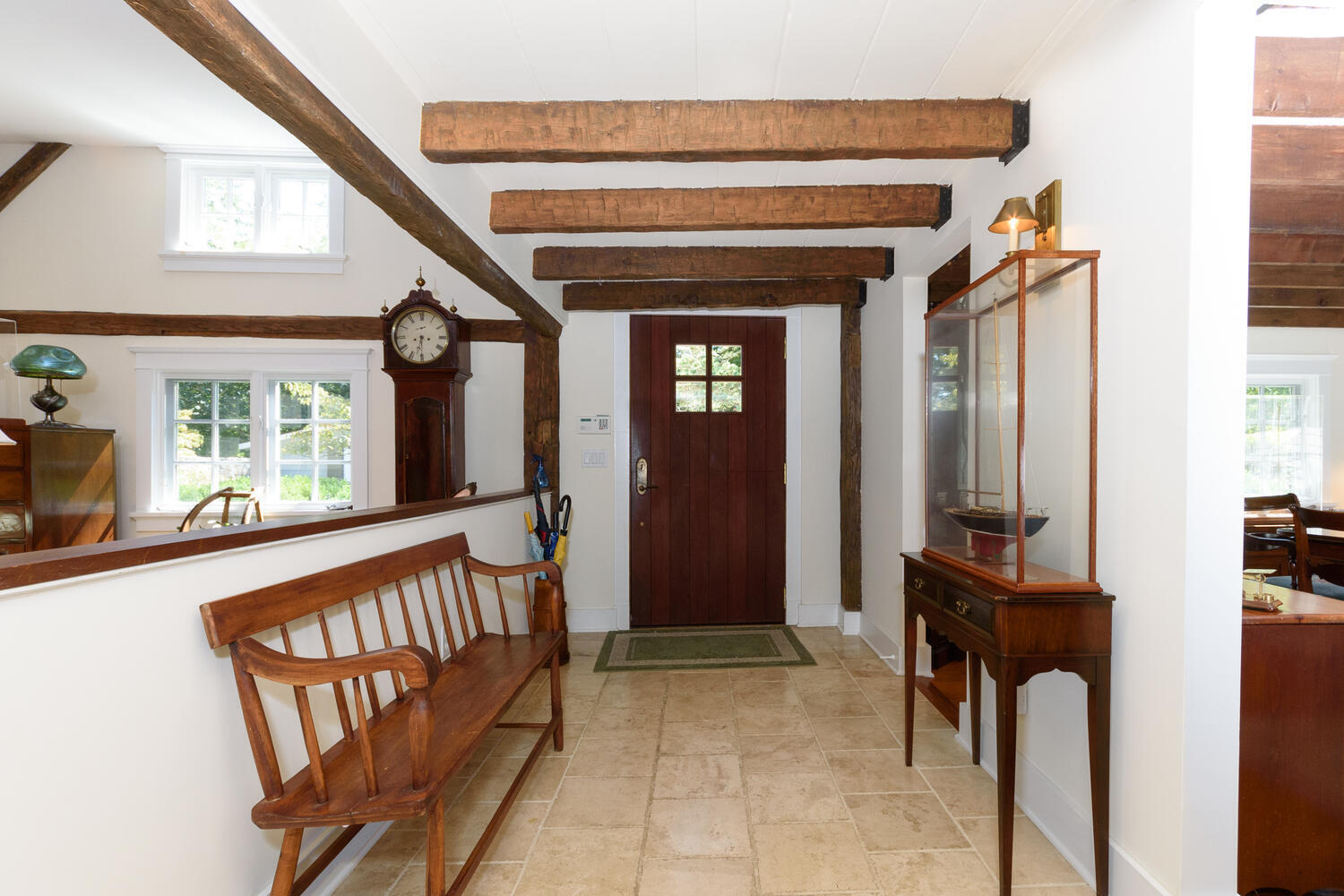 327 Hollow Tree Ridge Road Darien, CT 06820 - Photo 6 of 37 a view of a hallway with a dining table and chairs