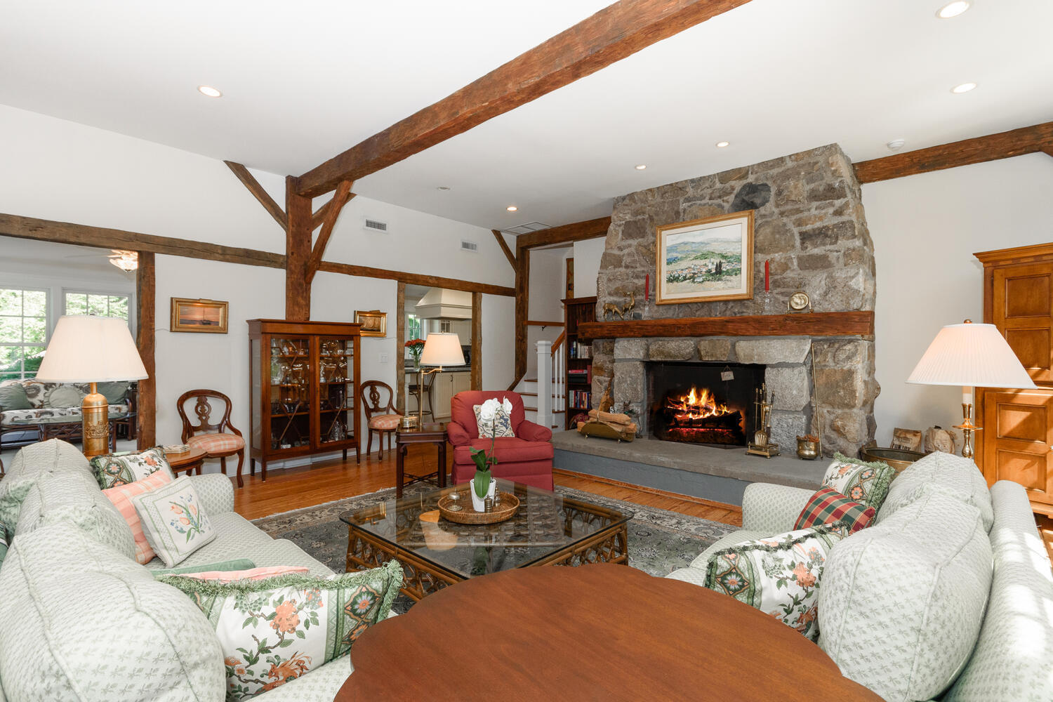 327 Hollow Tree Ridge Road Darien, CT 06820 - Photo 7 of 37 a living room with furniture and a fireplace