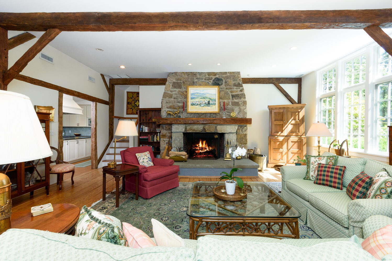 327 Hollow Tree Ridge Road Darien, CT 06820 - Photo 8 of 37 a living room with furniture a large window and a fireplace