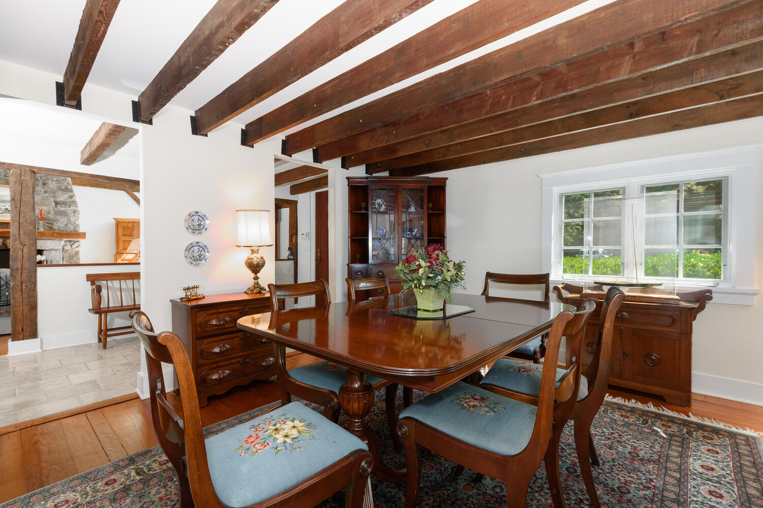 327 Hollow Tree Ridge Road Darien, CT 06820 - Photo 9 of 37 a view of a dining room with furniture and wooden floor