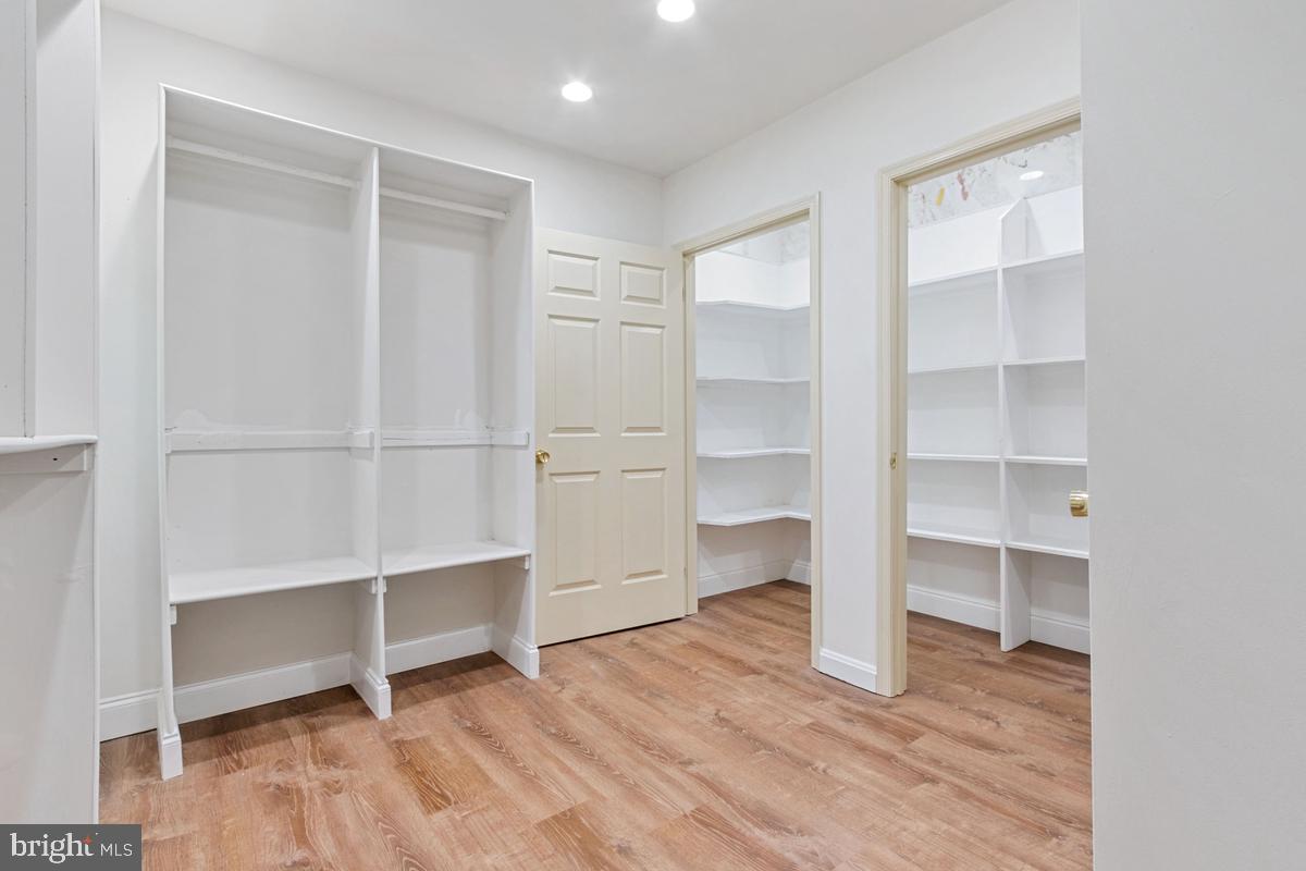 613 Rivercrest Drive McLean, VA 22101 - Photo 27 of 40 a room with walk in closet with empty racks
