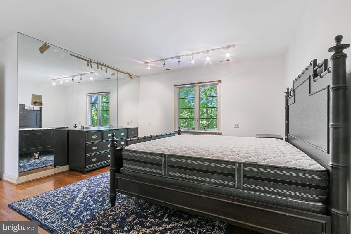 613 Rivercrest Drive McLean, VA 22101 - Photo 29 of 40 a bedroom with a bed and a dresser