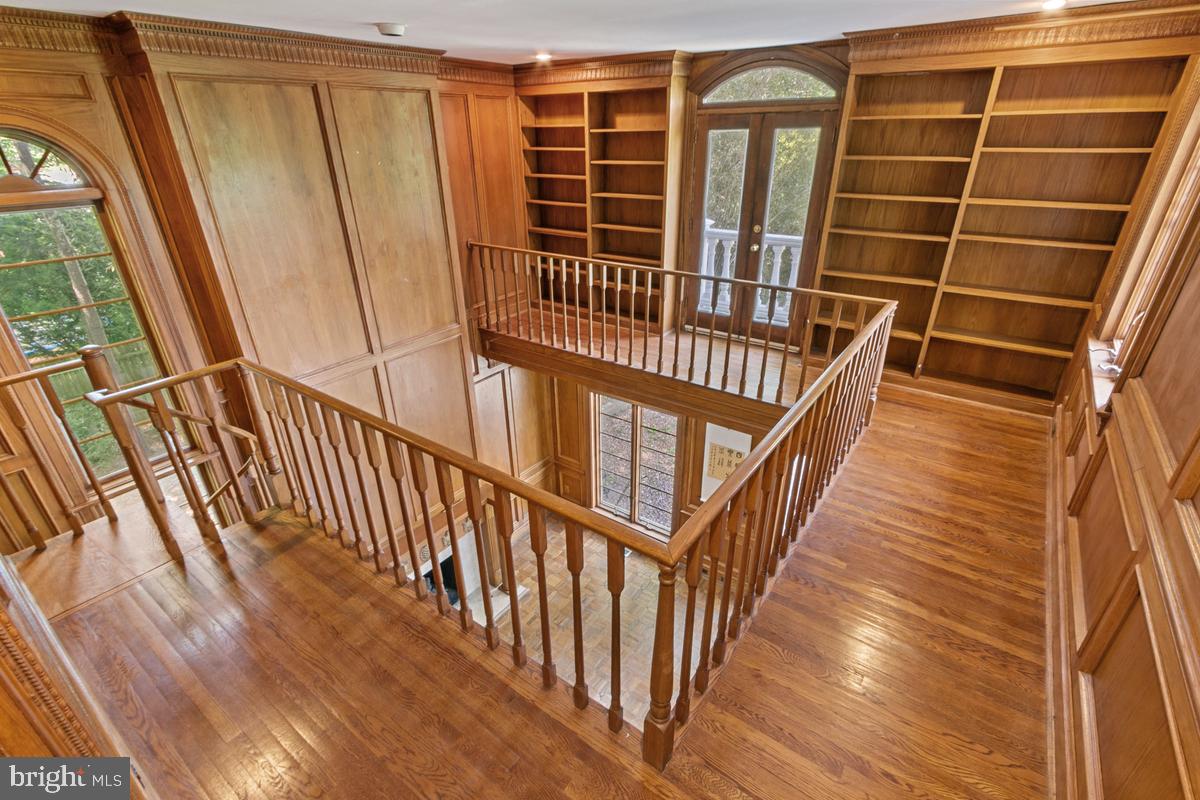 613 Rivercrest Drive McLean, VA 22101 - Photo 30 of 40 a view of staircase with wooden floor and a window