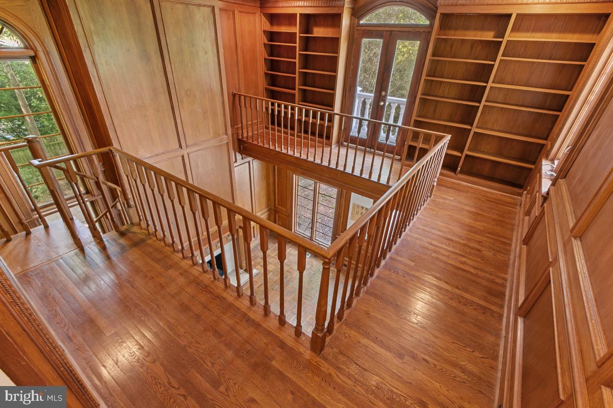 613 Rivercrest Drive McLean, VA 22101 - Photo 31 of 40 a view of staircase with wooden floor and white walls