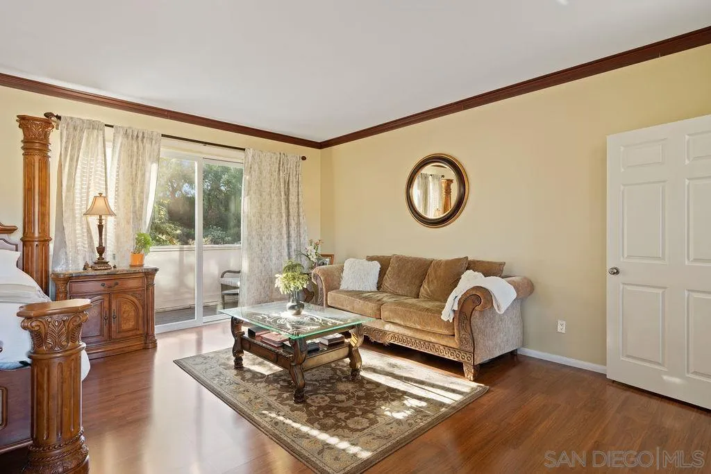 197 Double Eagle Glen Escondido, CA 92026 - Photo 22 of 70 a living room with furniture a large window and a wooden floor