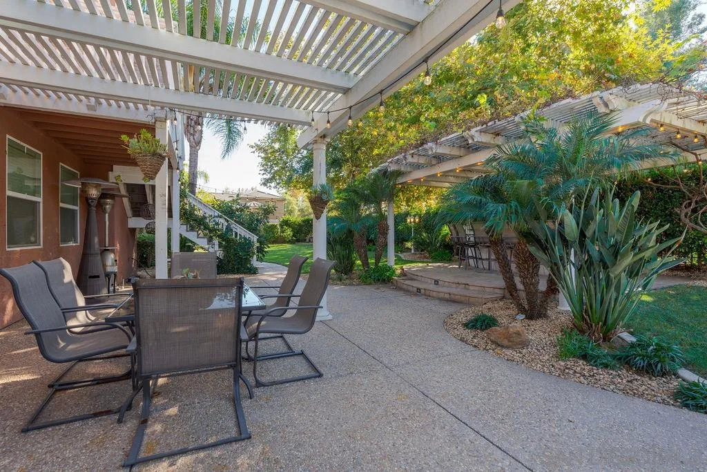 197 Double Eagle Glen Escondido, CA 92026 - Photo 49 of 70 a view of a patio with table and chairs and potted plants