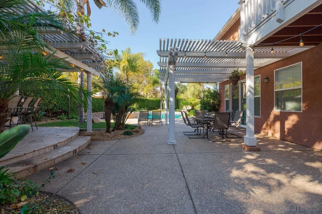 197 Double Eagle Glen Escondido, CA 92026 - Photo 52 of 70 a view of a patio with table and chairs and potted plants