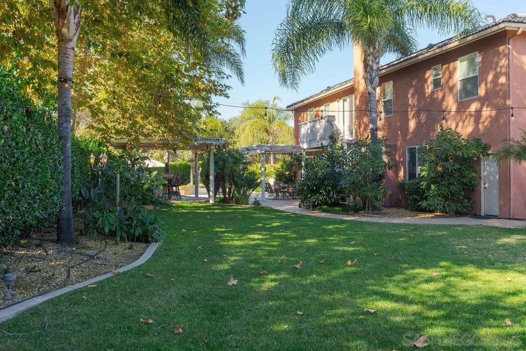 197 Double Eagle Glen Escondido, CA 92026 - Photo 56 of 70 a view of a house with a yard and potted plants