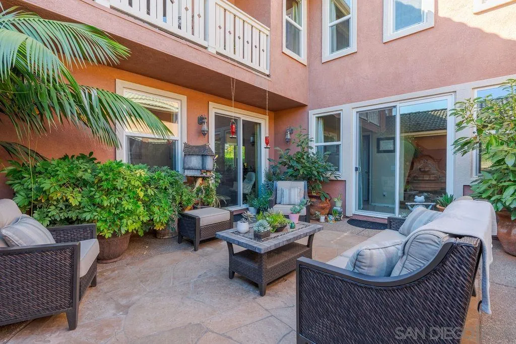 197 Double Eagle Glen Escondido, CA 92026 - Photo 9 of 70 a view of a patio with couches table and chairs and potted plants