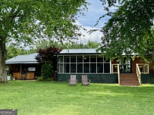 360 Morgan Mill Road Brooks, GA 30205 - Photo 51 of 87 a front view of a house with a yard and trees