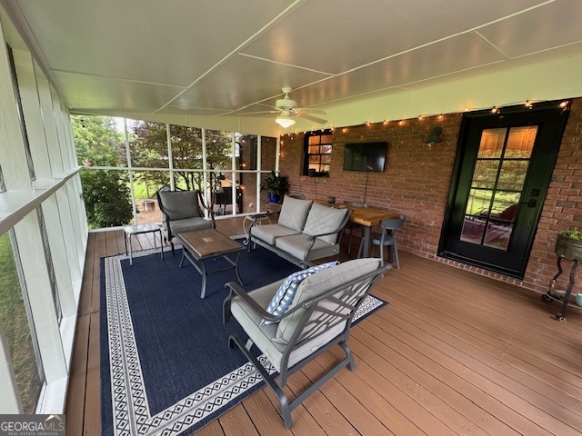 360 Morgan Mill Road Brooks, GA 30205 - Photo 53 of 87 a living room with furniture and a floor to ceiling window