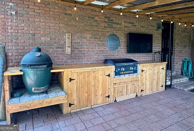 360 Morgan Mill Road Brooks, GA 30205 - Photo 56 of 87 a kitchen with stainless steel appliances a stove and cabinets