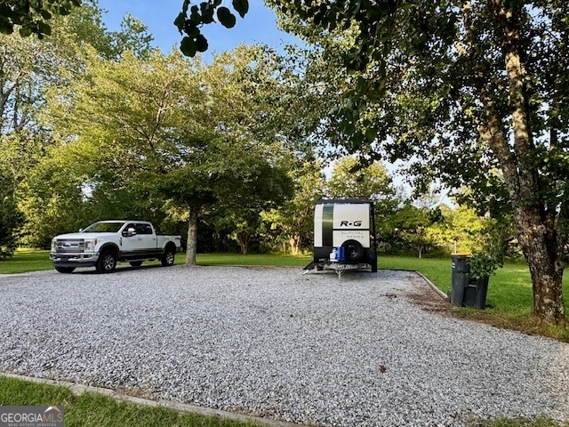 360 Morgan Mill Road Brooks, GA 30205 - Photo 65 of 87 a view of a house with a sink and a car parked